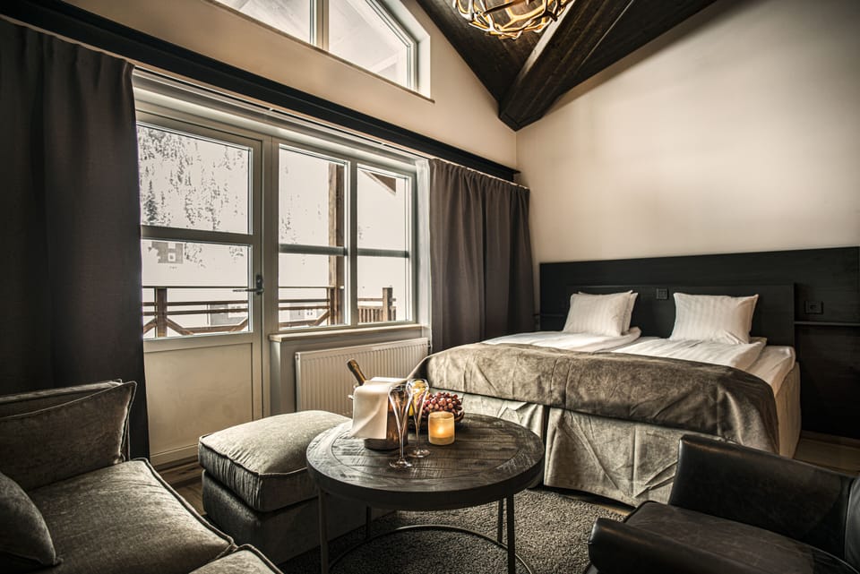 Junior Suite (Incl. Spa Access) | Desk, laptop workspace, blackout drapes, iron/ironing board
