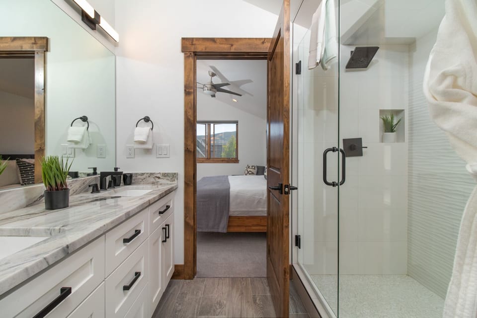Master Ensuite Bath with Dual Sinks and Rain Shower.