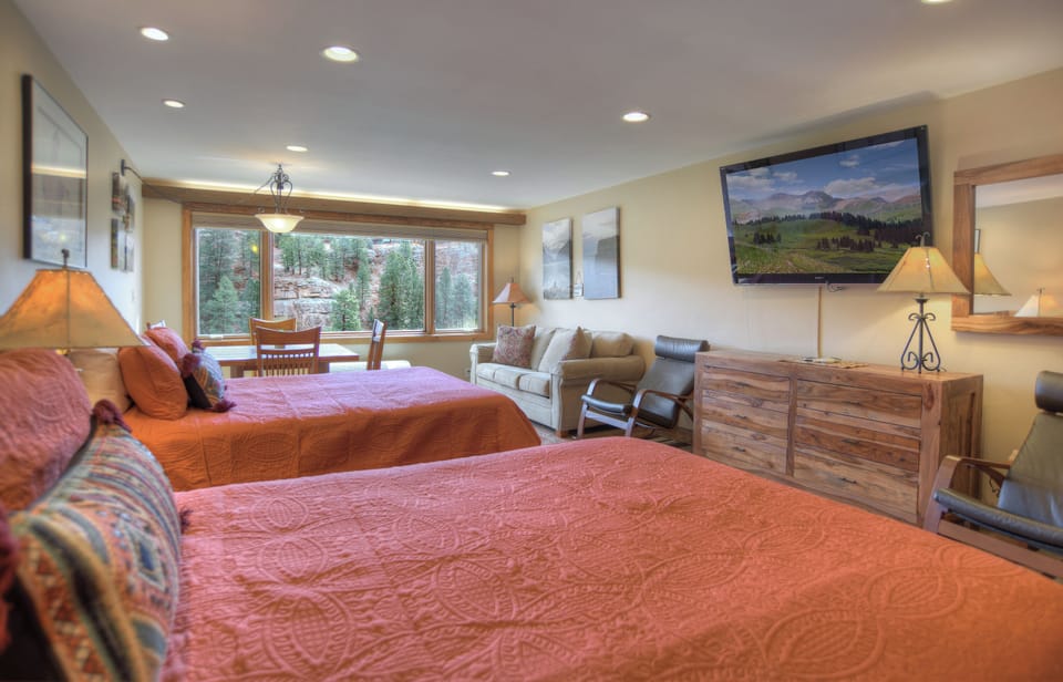 Unwind and enjoy—two queen beds paired with a Smart TV for ultimate comfort.