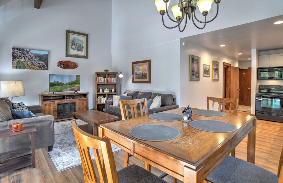Open concept living room, dining room, and kitchen area, with plenty of natural light.