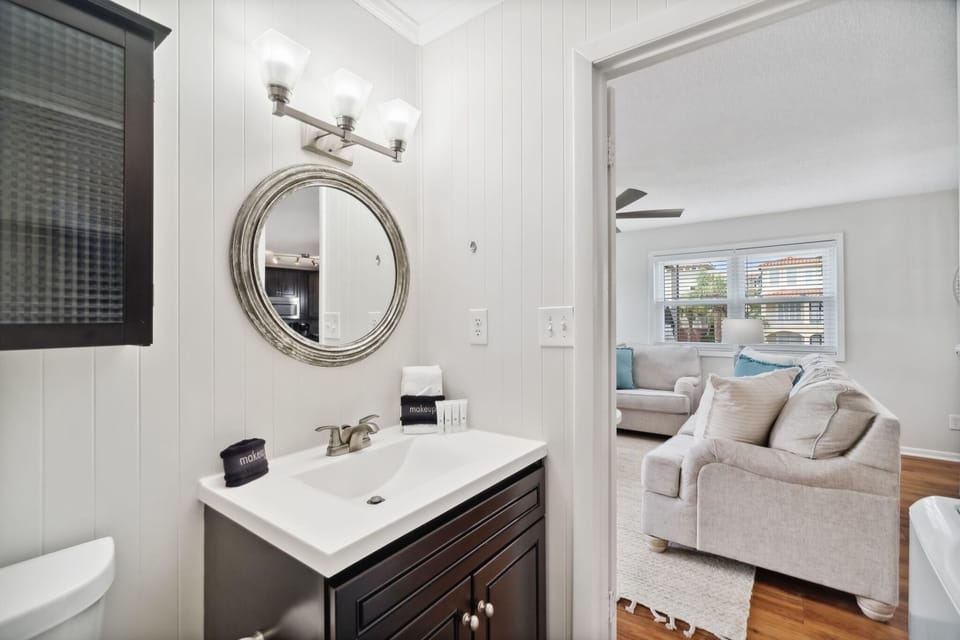Main Floor Toilet Room with Single Vanity and Washer/Dryer