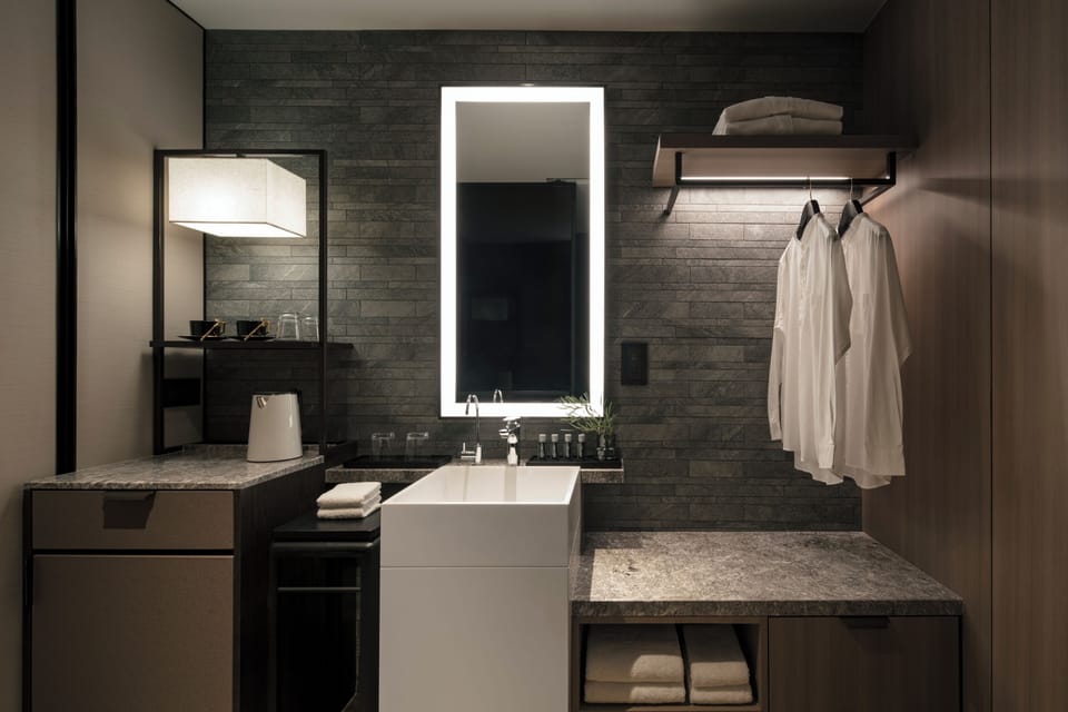 Designer toiletries, hair dryer, bathrobes, slippers