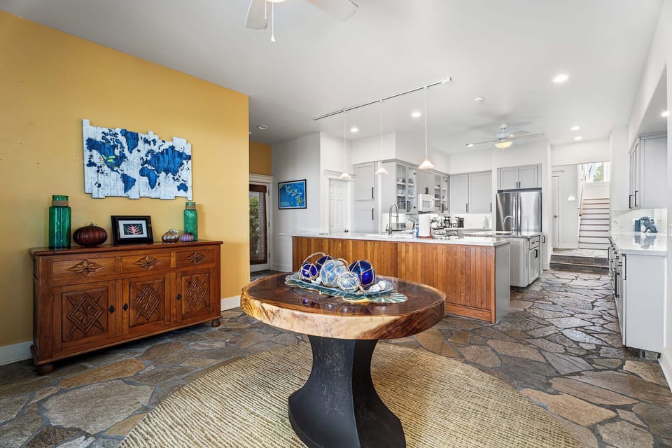 Natural light fills this casual dining space with seamless access to the kitchen and lanai.
