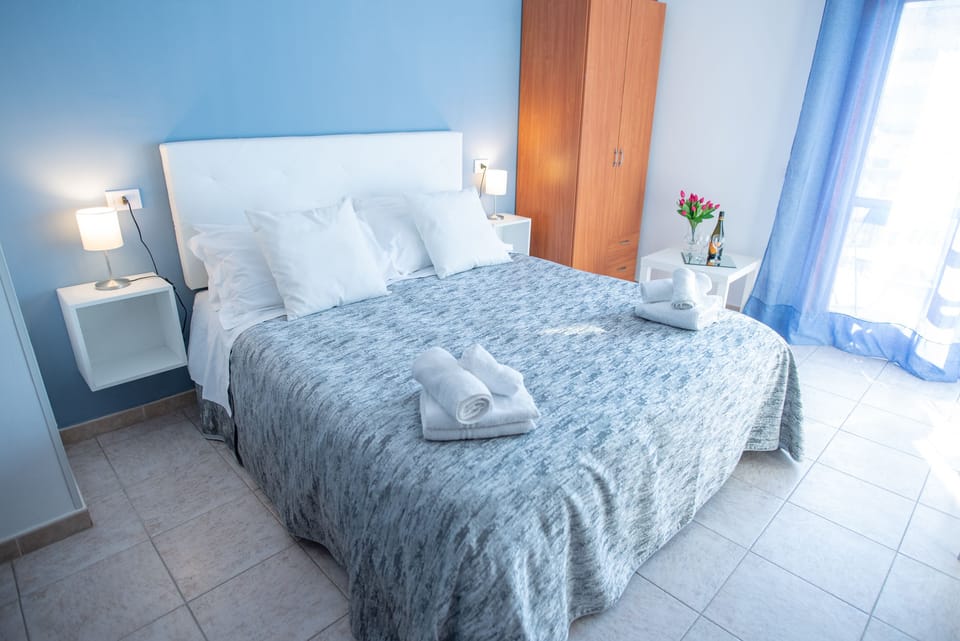 Economy Quadruple Room, Private Bathroom | Down comforters, rollaway beds, free WiFi, bed sheets