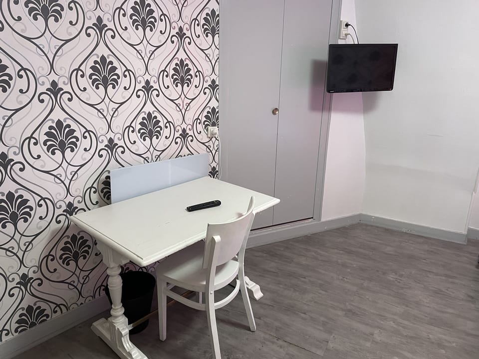 Quadruple Room | Living area | 40-cm flat-screen TV with cable channels, TV