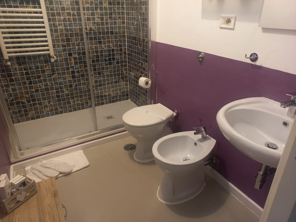 Deluxe Triple Room, City View | Desk, blackout drapes, iron/ironing board (on request), travel crib