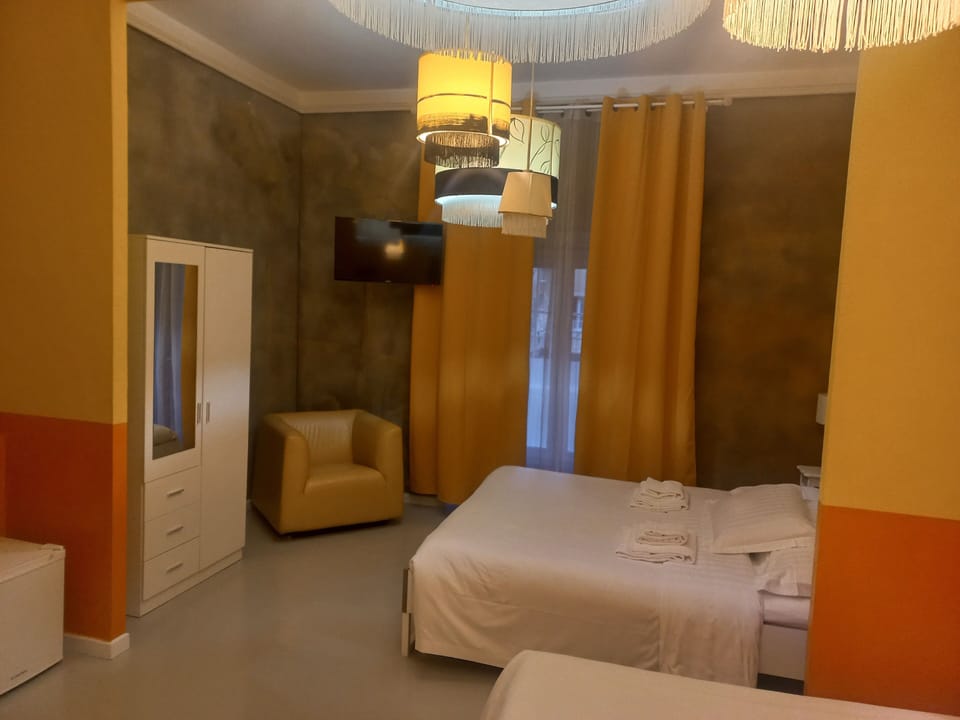 Premium Quadruple Room | Individually decorated, desk, blackout drapes, iron/ironing board