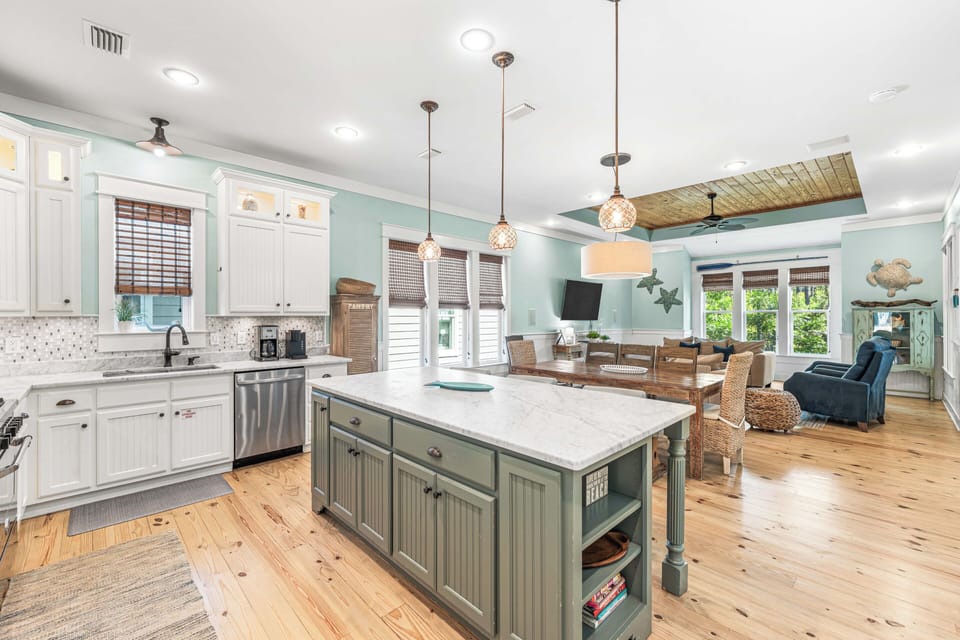 The open kitchen, dining, and living areas are the perfect space to entertain.