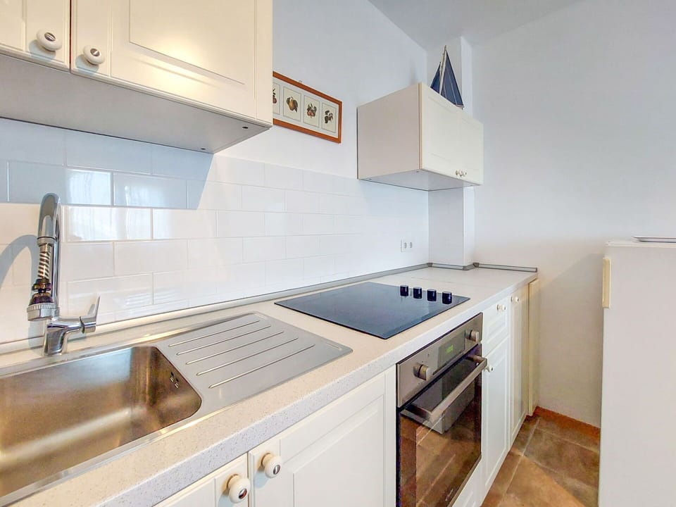 Kitchen, Countertop, Kitchen Appliance, Major Appliance, Flooring, Cabinetry, Interior Design, Floor, Room, Home
