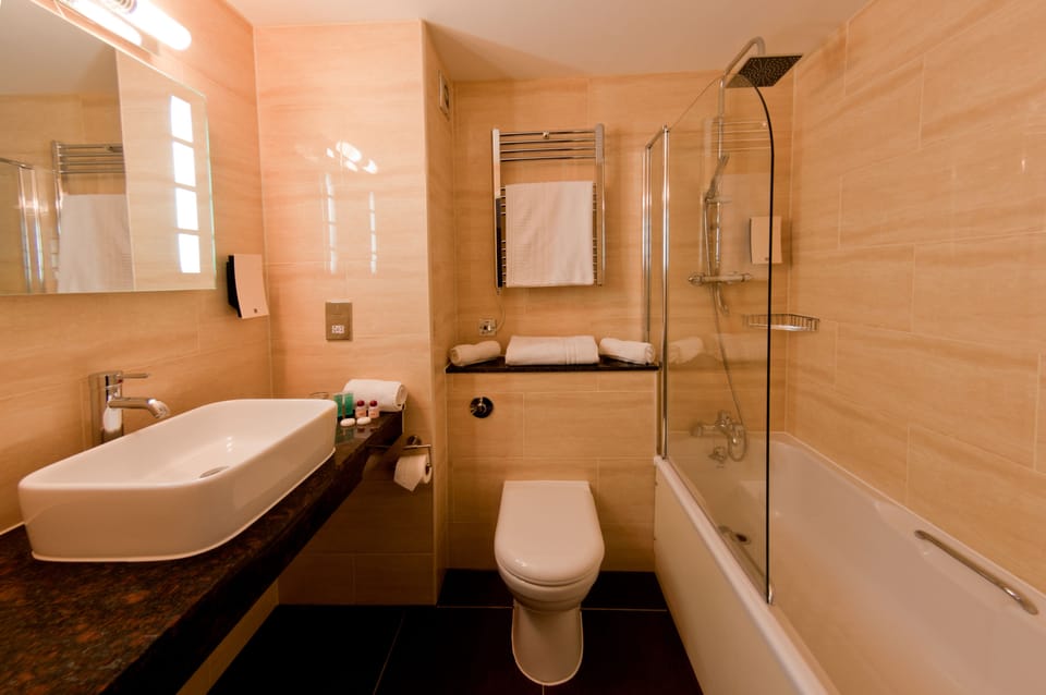 Combined shower/tub, hair dryer, towels, soap