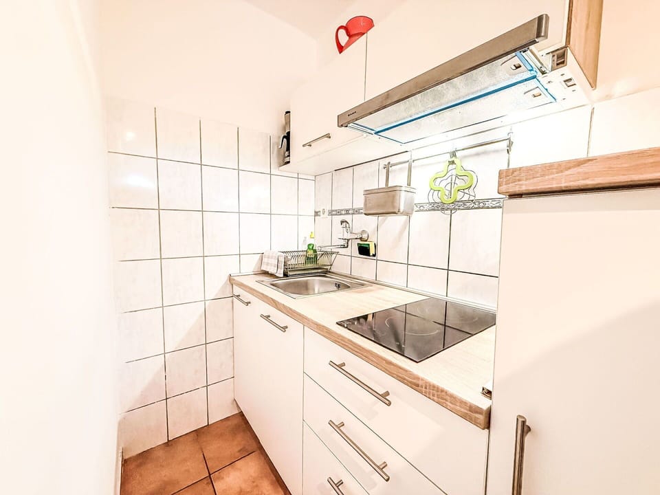 Flooring, Interior Design, Major Appliance, Floor, Kitchen, Countertop, Kitchen Appliance, Room, Plumbing Fixture, Ceiling