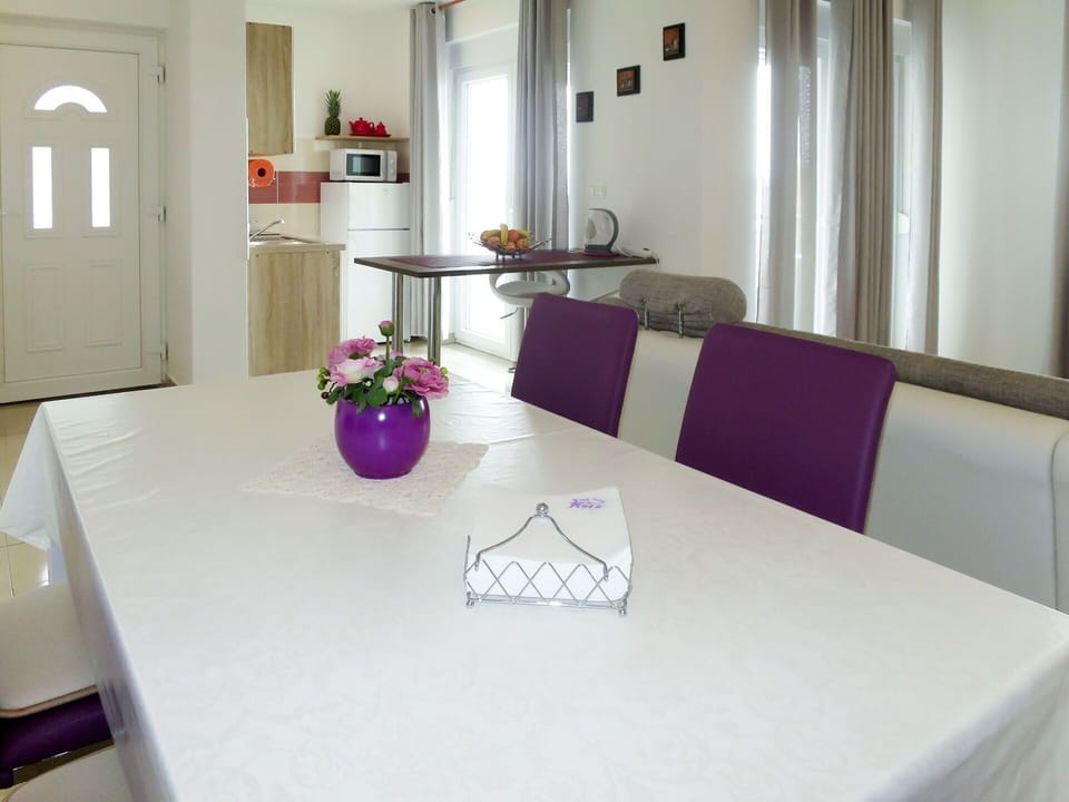 Table, Furniture, Chair, Houseplant, Plant, Interior Design, Purple, Cabinetry, Lighting, Flowerpot
