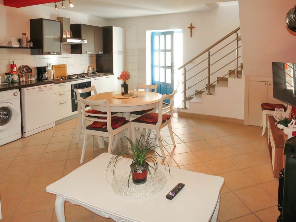 Table, Furniture, Property, Cabinetry, Countertop, Kitchen Appliance, Houseplant, Lighting, Desk, Kitchen Stove