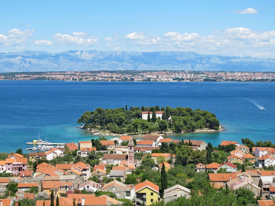 Water, Sky, Cloud, Water Resources, Azure, Tree, Natural Landscape, Beach, Coastal And Oceanic Landforms, Plant