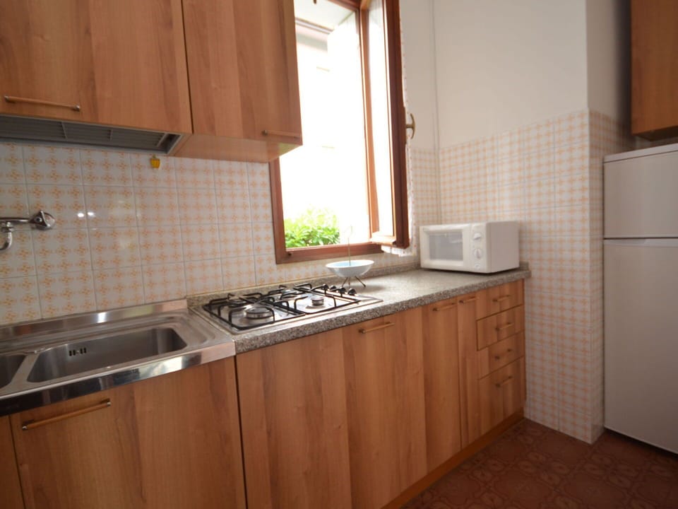 Brown, Kitchen Sink, Cabinetry, Countertop, Kitchen Stove, Kitchen Appliance, Wood, Gas Stove, Sink, Kitchen
