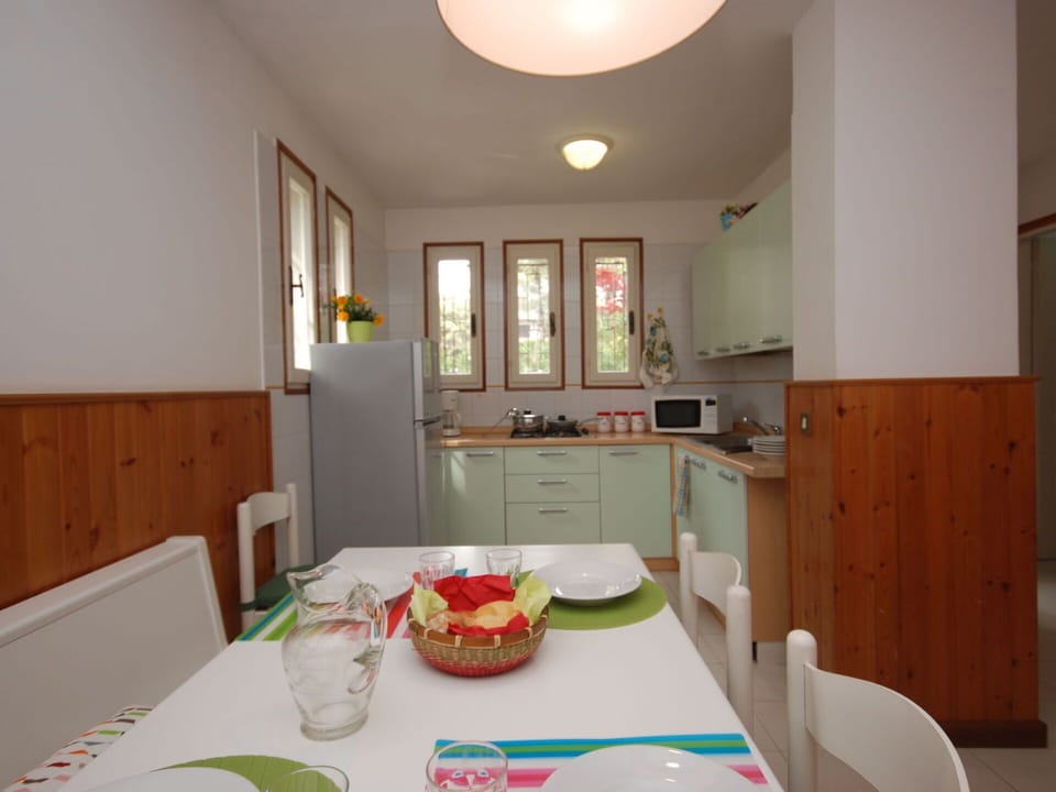 Table, Furniture, Property, Cabinetry, Tableware, Lighting, Interior Design, Wood, Chair, Floor