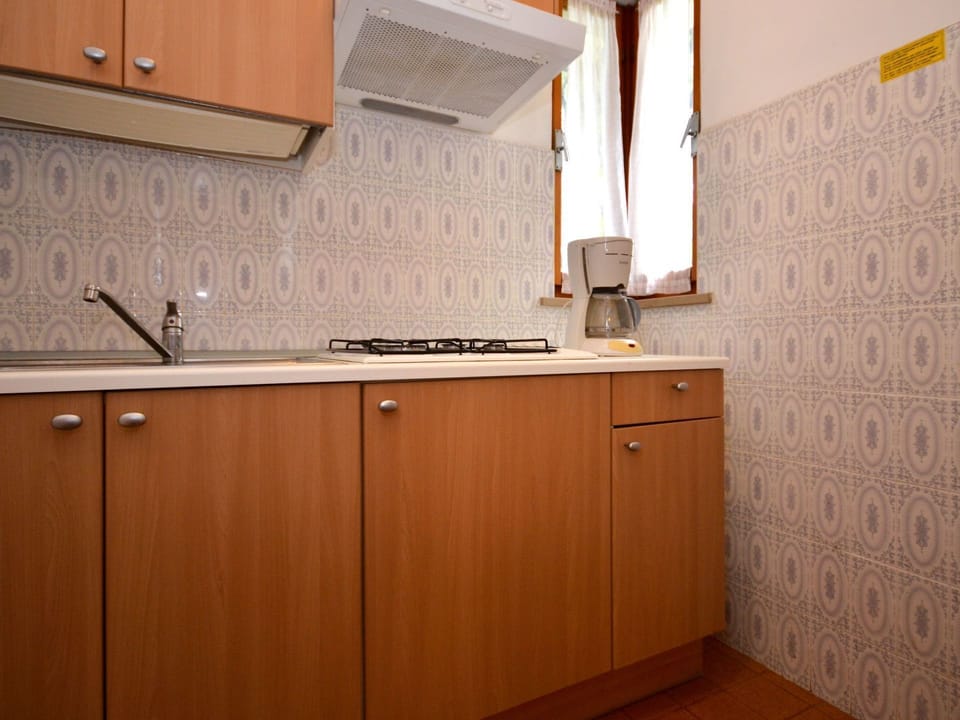Room, Cabinetry, Property, Kitchen, Furniture, Countertop, Interior Design, Floor, Material Property, Building