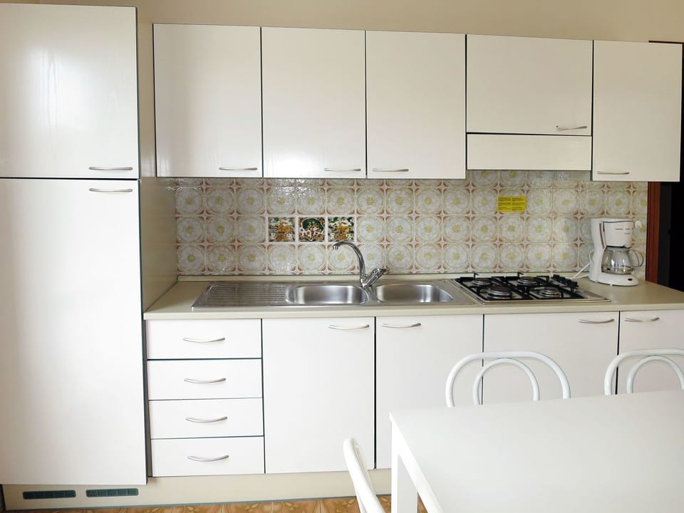 Countertop, Room, Furniture, Kitchen, Cabinetry, Property, Tile, Interior Design, Floor, Cupboard