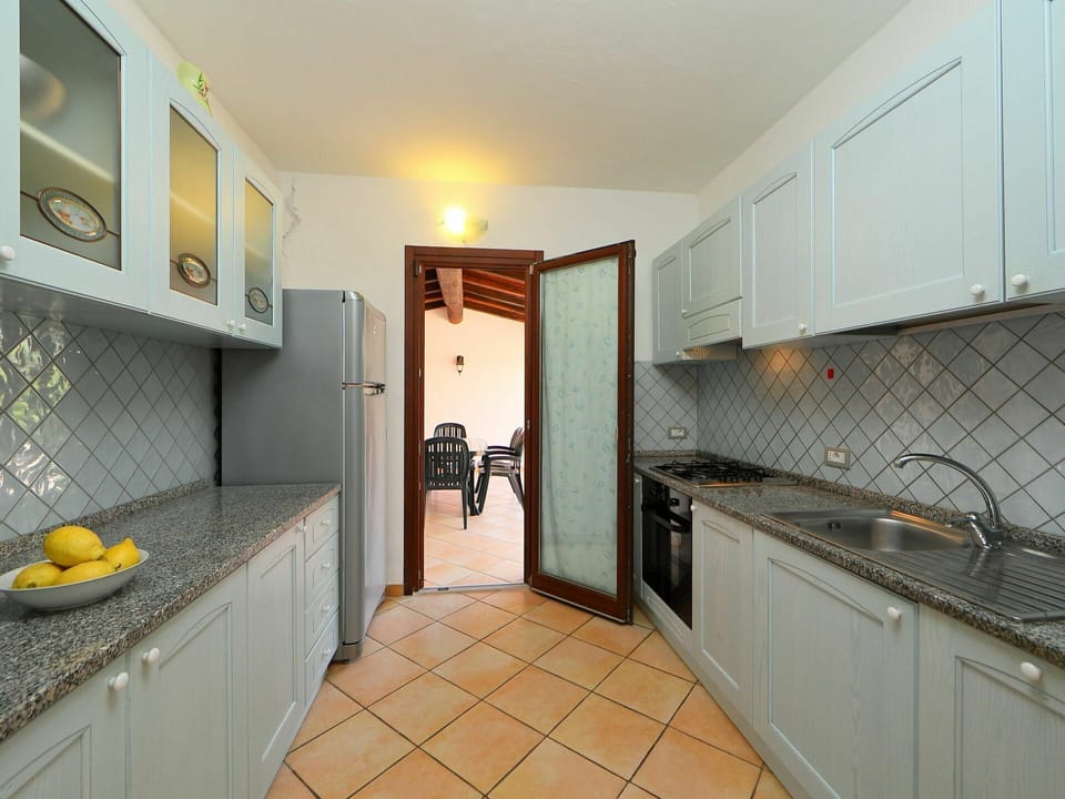 Property, Room, Countertop, Kitchen, Cabinetry, Furniture, Real Estate, Yellow, Tile, Building