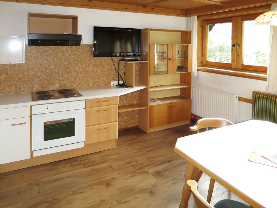 Countertop, Furniture, Room, Cabinetry, Property, Kitchen, Floor, Interior Design, Wood Flooring, Building