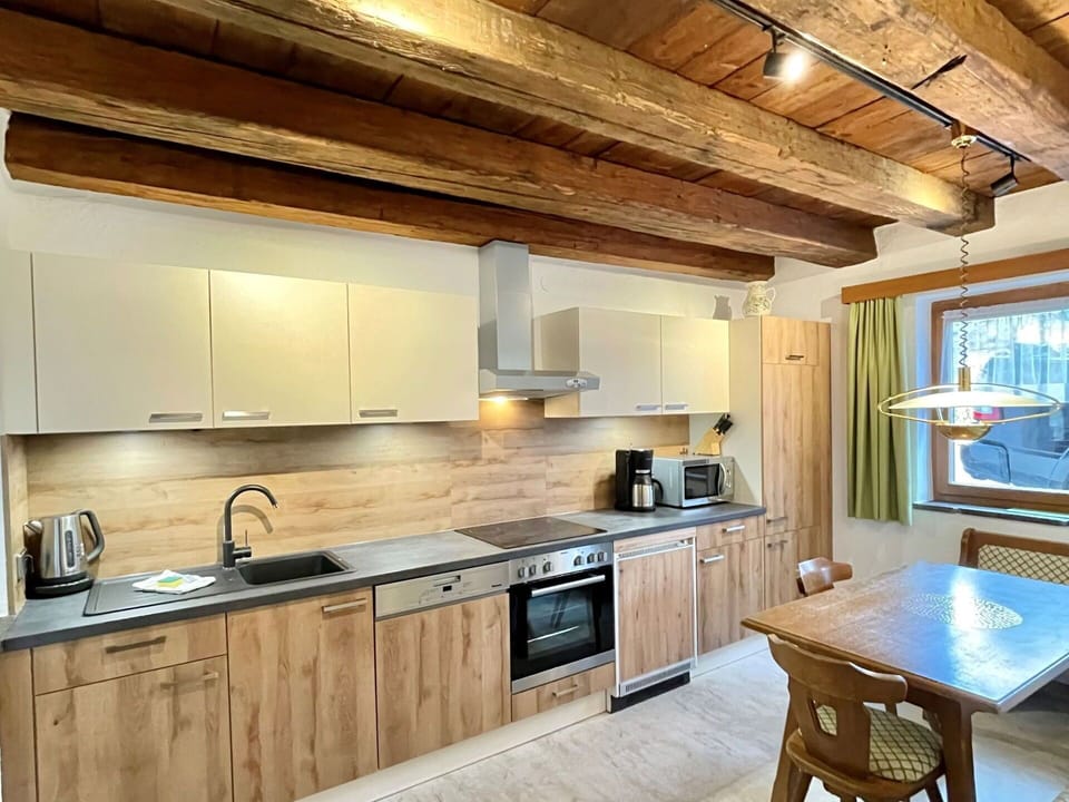 Countertop, Cabinetry, Property, Kitchen Sink, Sink, Kitchen, Wood, Kitchen Appliance, Lighting, Interior Design