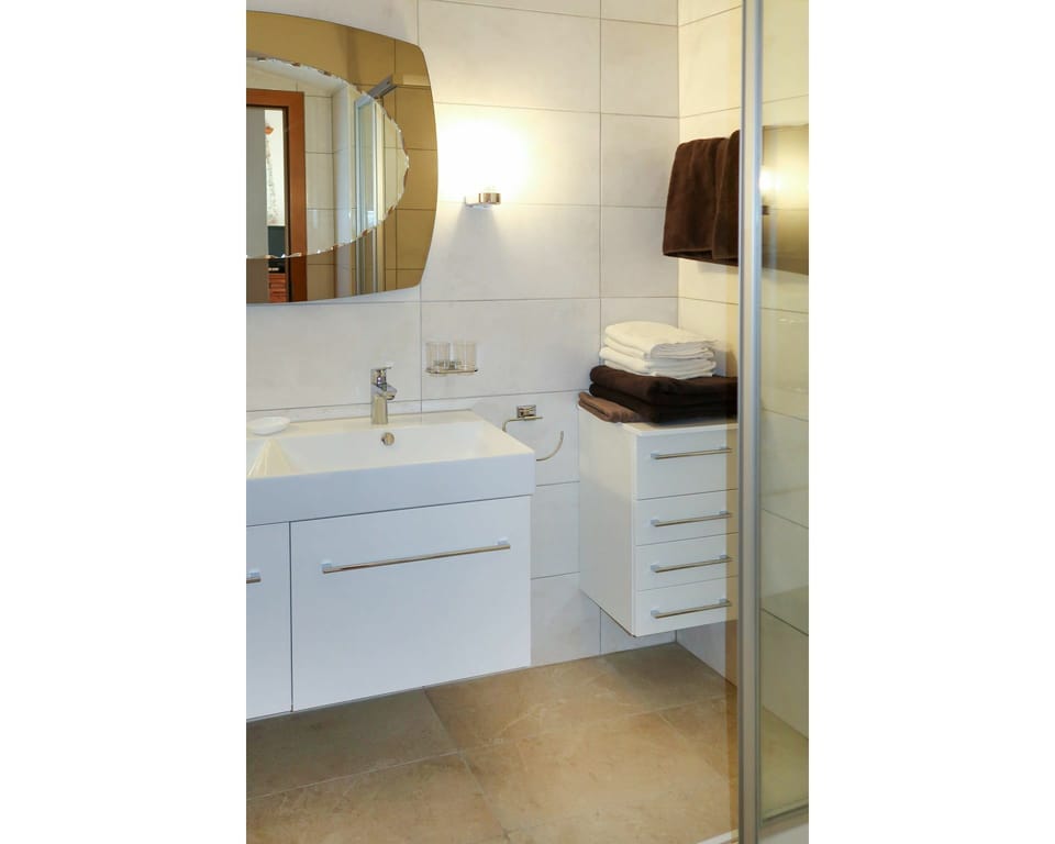 Mirror, Cabinetry, Tap, Sink, Building, Property, Bathroom Cabinet, Plumbing Fixture, Countertop, Bathroom Sink