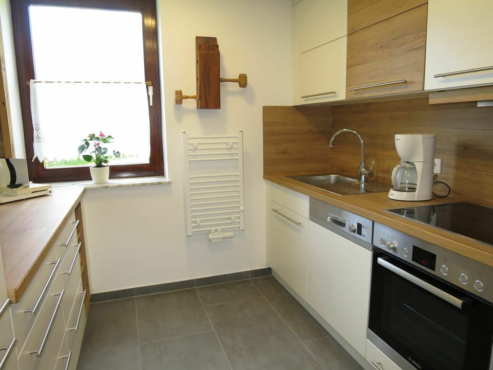 Room, Property, Countertop, Sink, Furniture, Kitchen, Floor, Cabinetry, Tile, Building