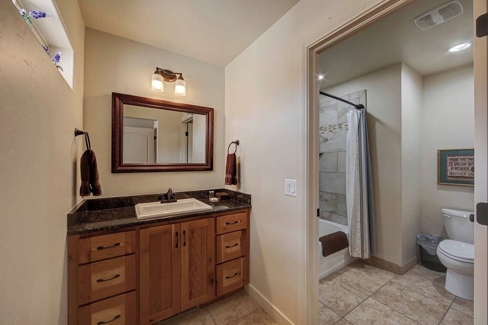 Upstairs bathroom with tub and shower for bedroom #2.