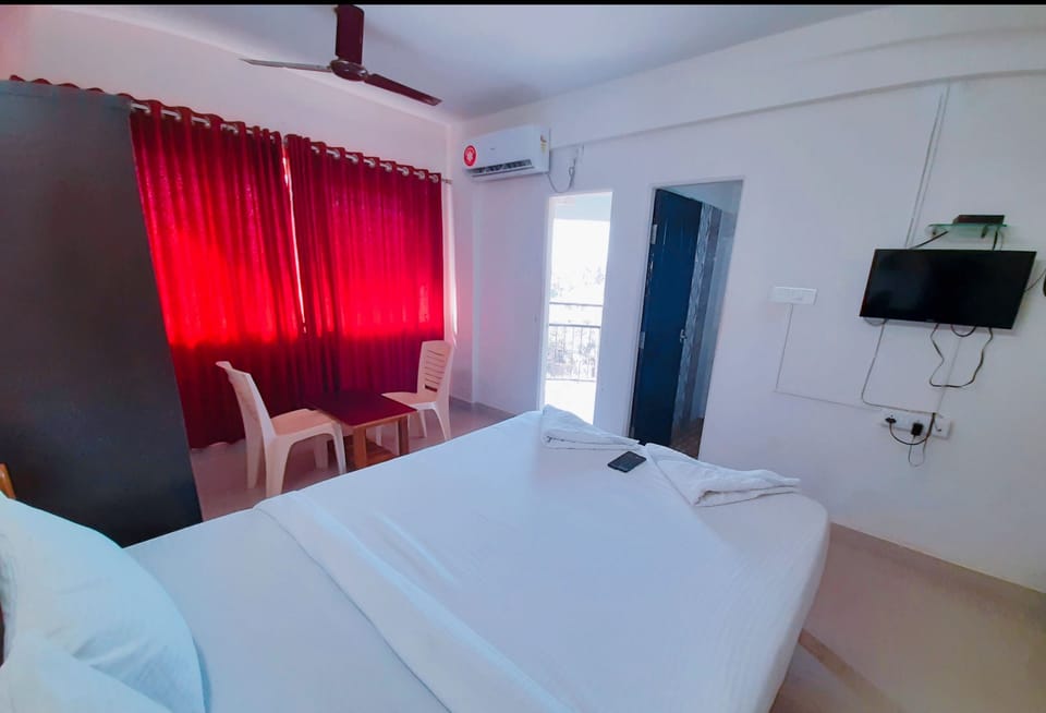 Deluxe Double Room | In-room safe, blackout drapes, iron/ironing board, cribs/infant beds