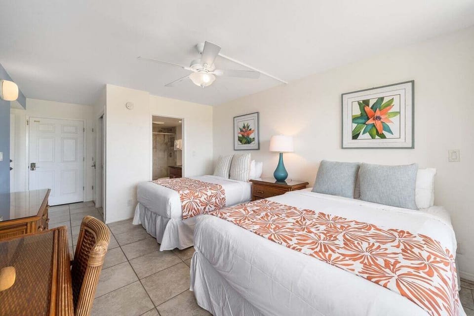 Enjoy restful nights in the bedroom furnished with two plush queen beds