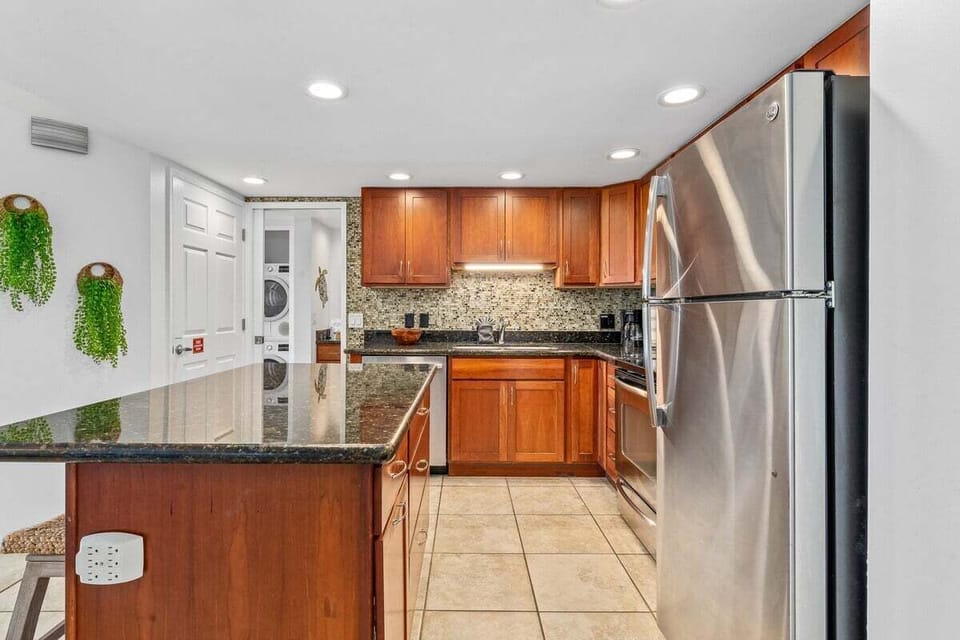 Functional kitchen with stainless steel appliances and wooden cabinets