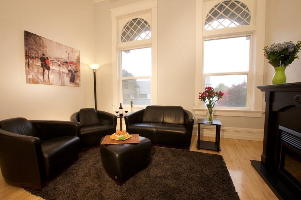 Comfortable living room with fireplace and view of Main Street.