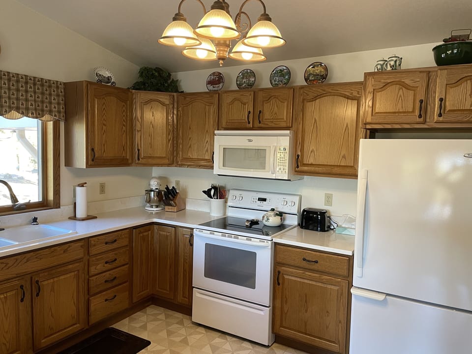 Kitchen with ice maker in freezer.
