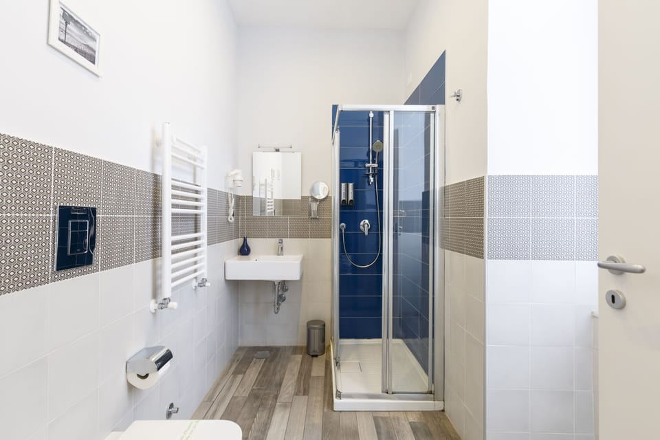 Standard Double Room (Spade) | Bathroom | Shower, hair dryer, slippers, bidet
