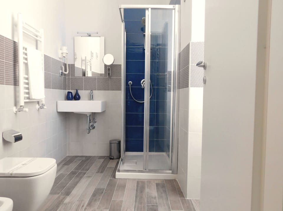 Standard Double Room (Spade) | Bathroom | Shower, hair dryer, slippers, bidet