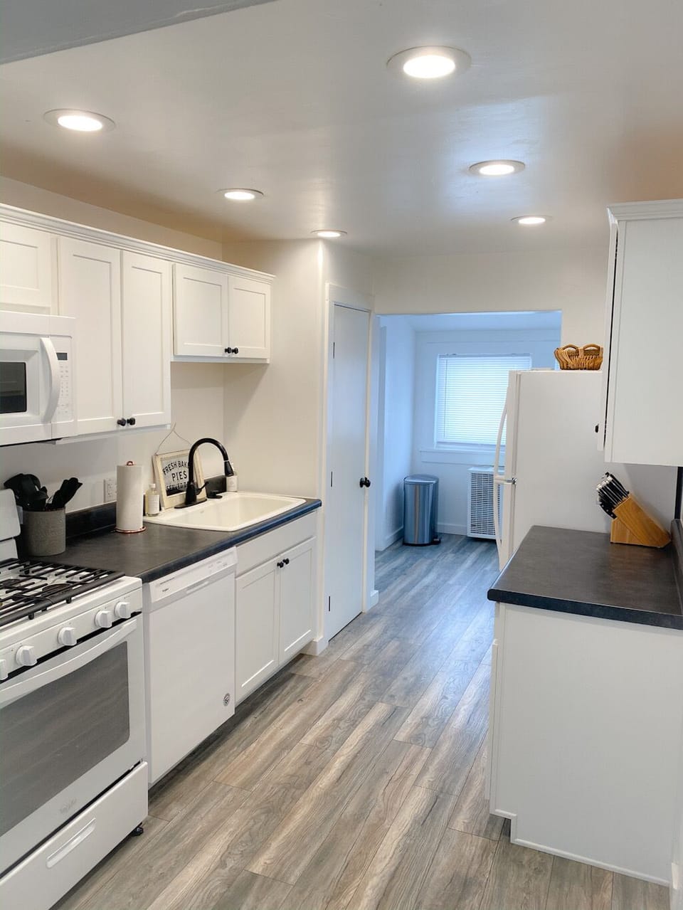 Brand new kitchen features microwave, dishwasher, waffle maker, coffee, and more