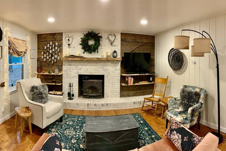 Relax in the warm and comfy living area - complete with wood-burning stove.