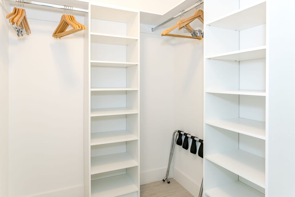 Walk-in closet with hangers.