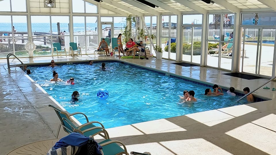 Glass enclosed indoor pool with a gorgeous gulf view