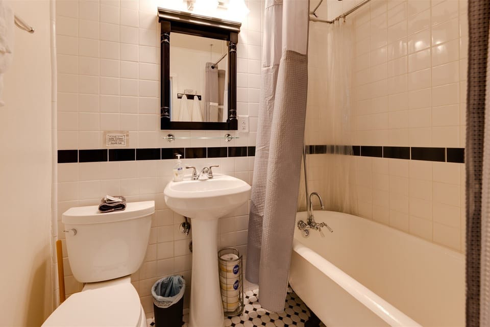 En Suite Bath- Beautifully tiled master bathroom with clawfoot tub.
