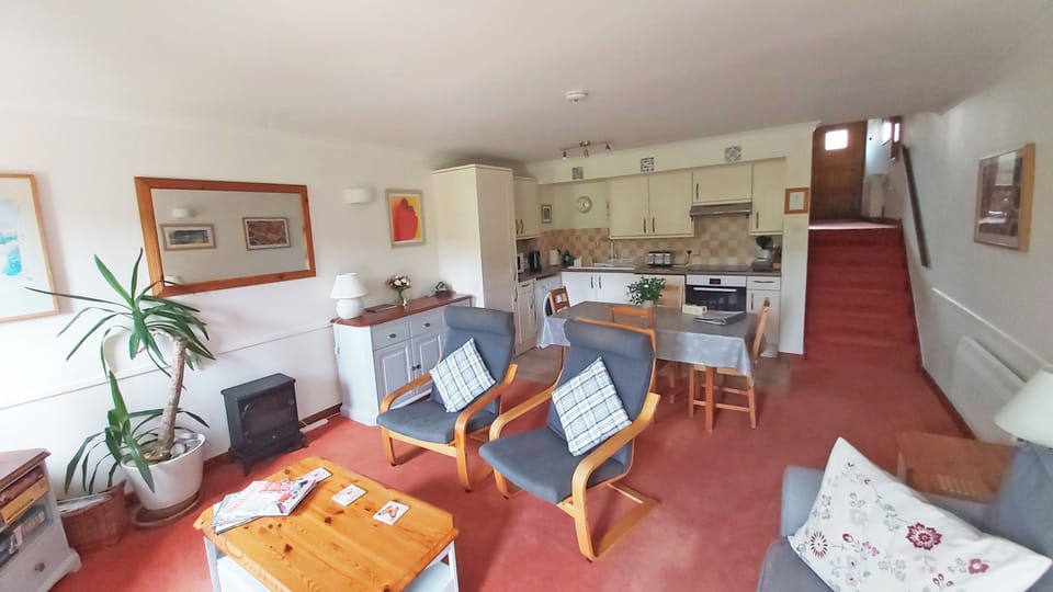 Living area on lower ground floor with kitchen diner.