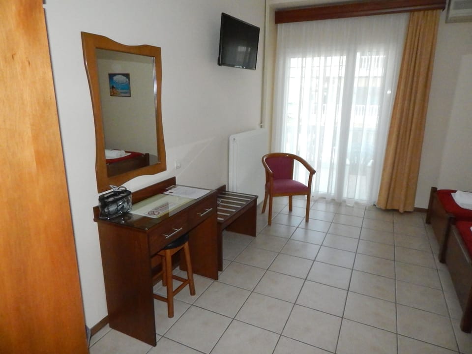 Standard Triple Room | Minibar, in-room safe, desk, blackout drapes