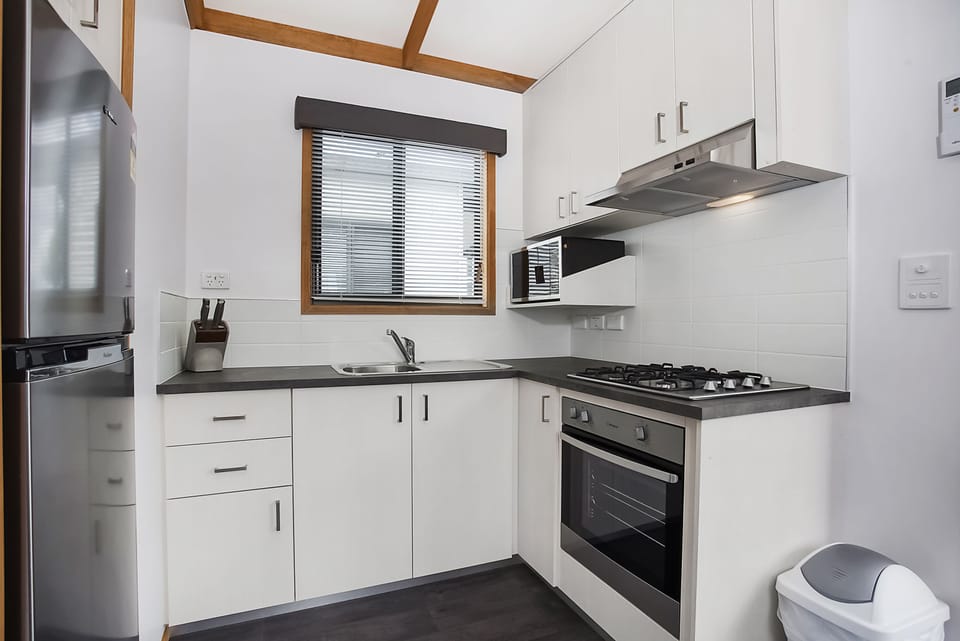 Family Cabin, 2 Bedrooms | Private kitchen | Full-size fridge, microwave, stovetop, coffee/tea maker