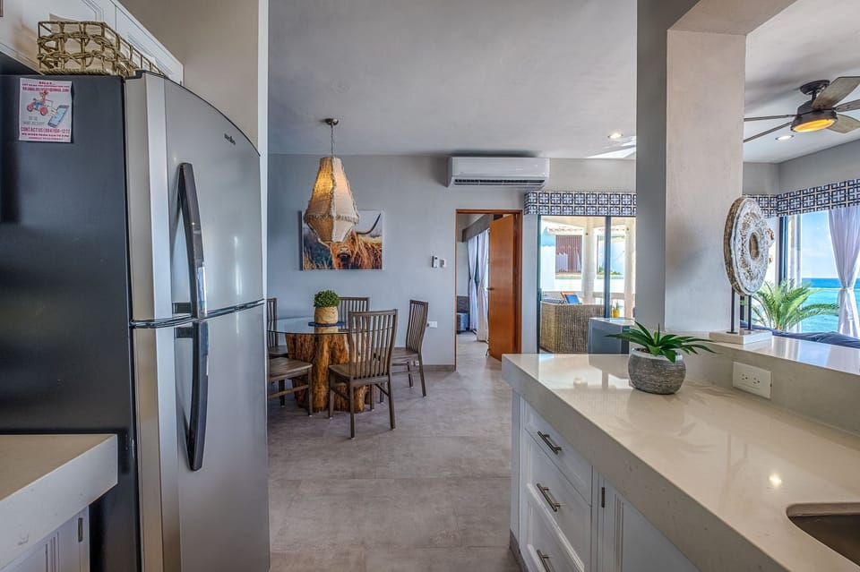 View from the kitchen to the dining area and master bedroom.