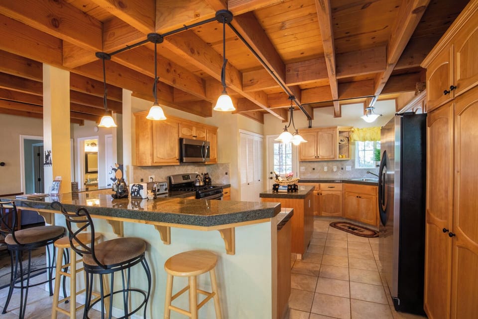 Full-sized kitchen stocked with all utensils to make a large family meal.  