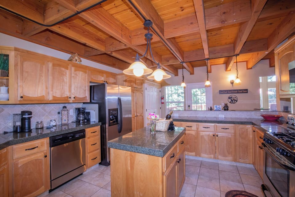 The entryway into the cabin opens up to the Full-size kitchen and dining room.