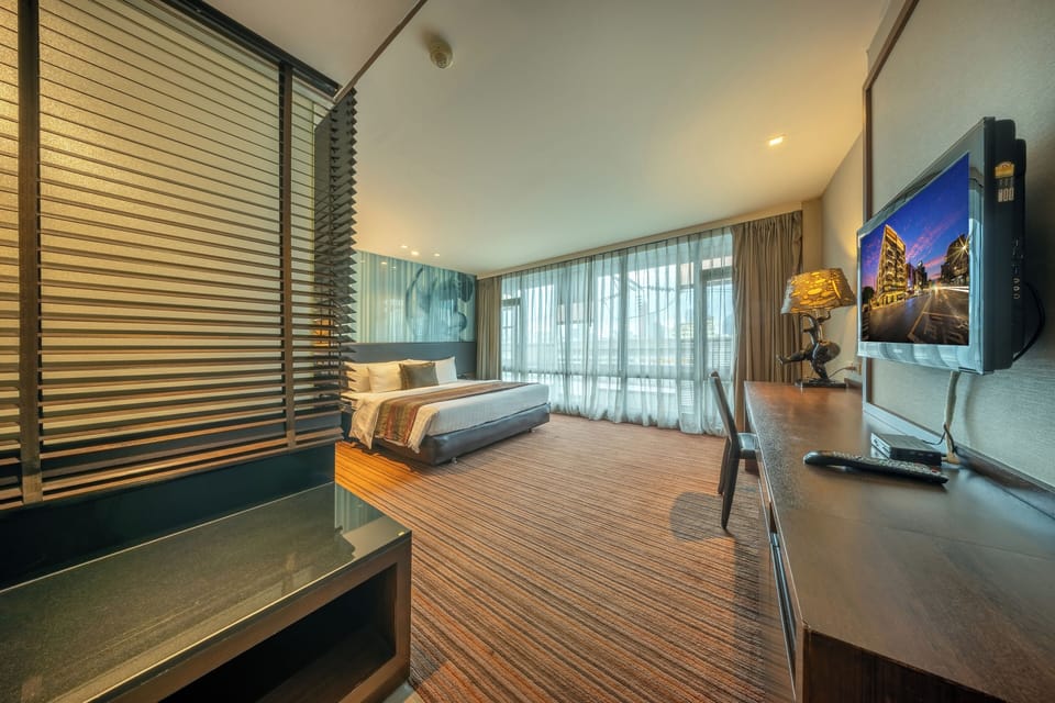 Suite, 1 King Bed, Corner | In-room safe, blackout drapes, iron/ironing board (on request)