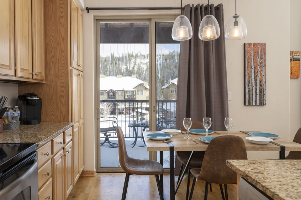 The luxurious Kitchen has a large sliding glass door leading to the patio