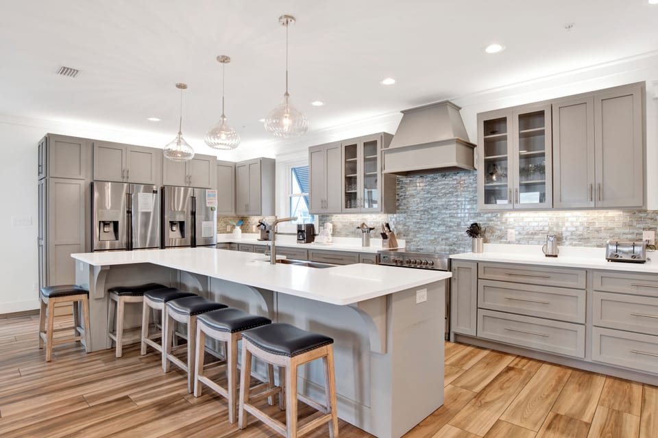 Fully equipped kitchen with dual appliances and stone counters
