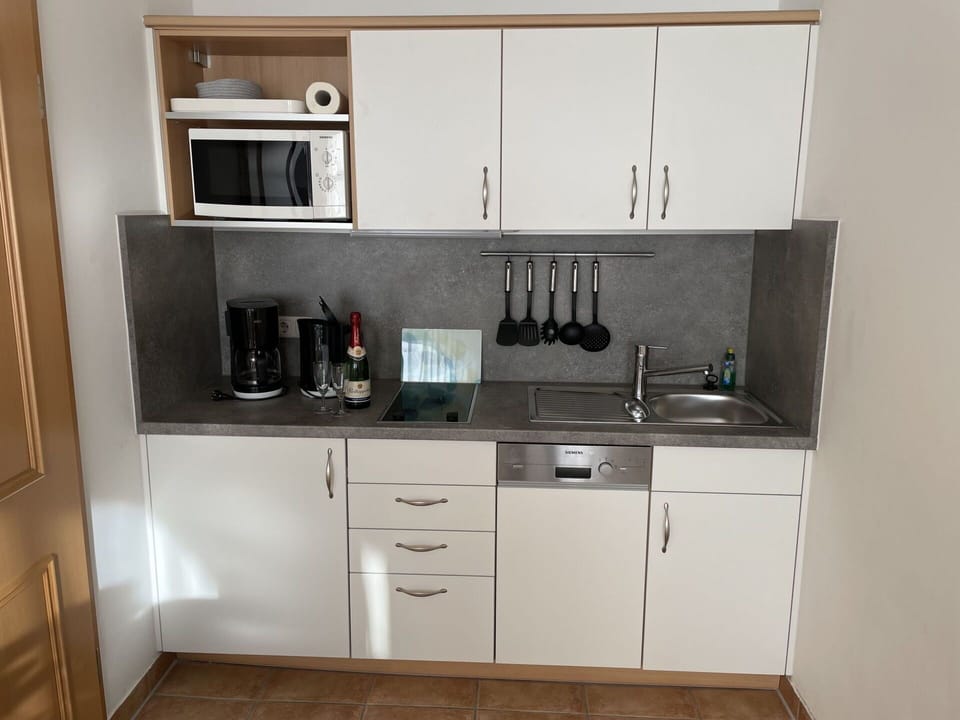 Cabinetry, Countertop, Kitchen Sink, Building, Sink, Kitchen Appliance, Kitchen, Kitchen Stove, Tap, Tableware